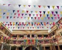 Cờ Dây Tam Giác Trang Trí Trường Học – Giải Pháp Trang Hoàng Đẹp, Bền, Tiết Kiệm Tại Xưởng May Cờ Hoàng Gia